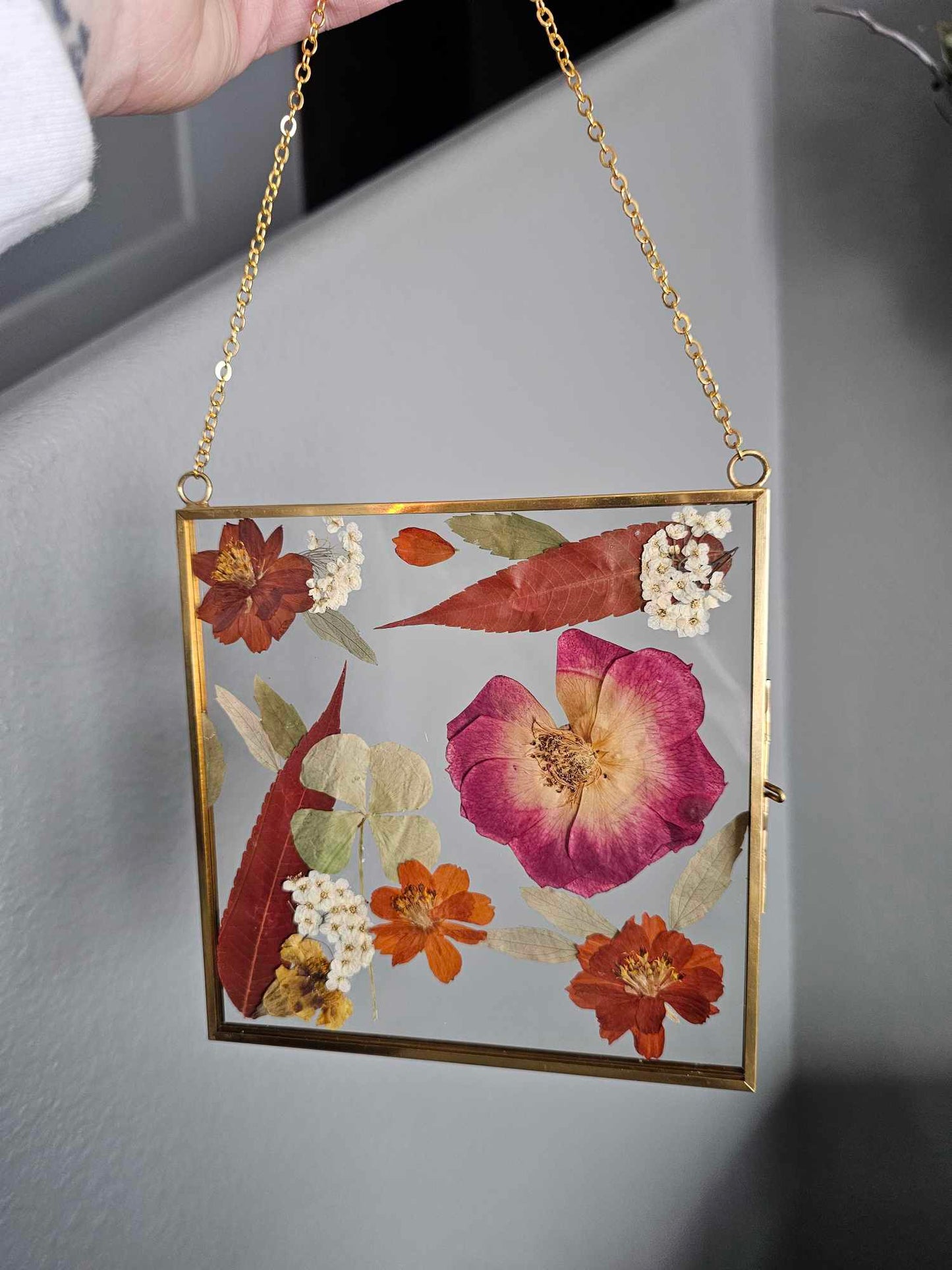 Vintage style gold square frame with pressed rust red, tan, natural and white flowers and leaves