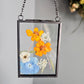 "mini" vintage style black frame with pressed blue and orange flowers