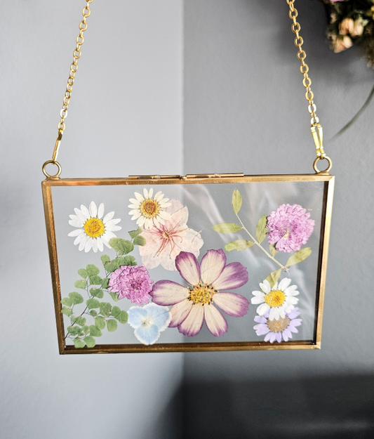 Vintage style gold frame with pressed pink, white, purple and blue flowers